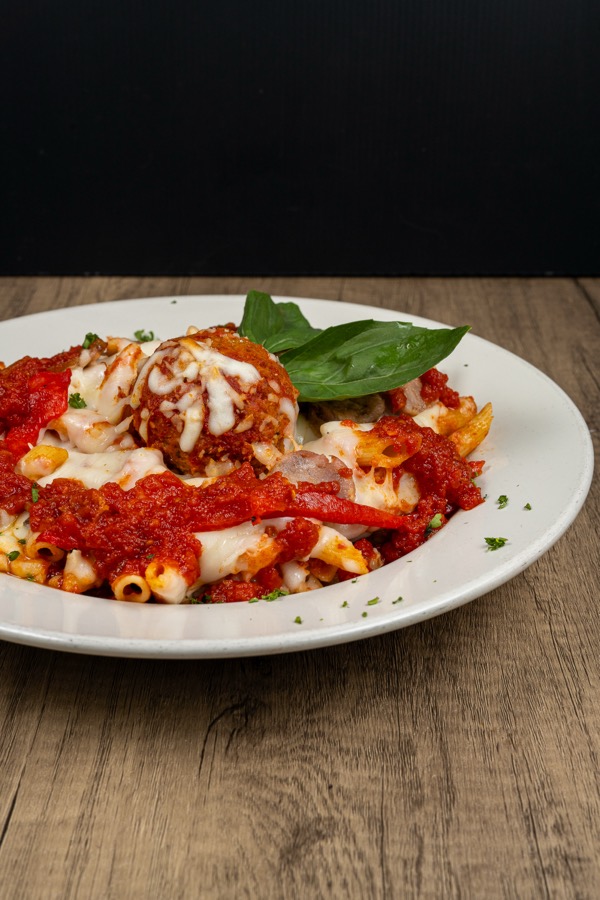 Baked pasta with meatball and tomato sauce