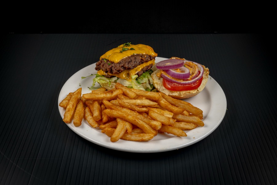 Burger with fries on a dark background