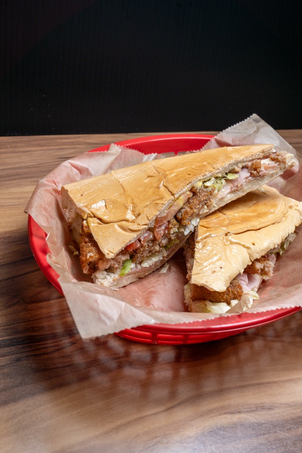 Pressed Cuban sandwich in a red basket