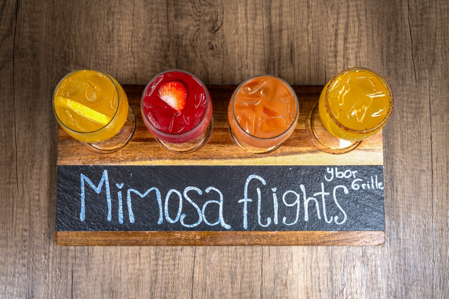 Mimosa flight on a chalkboard sign