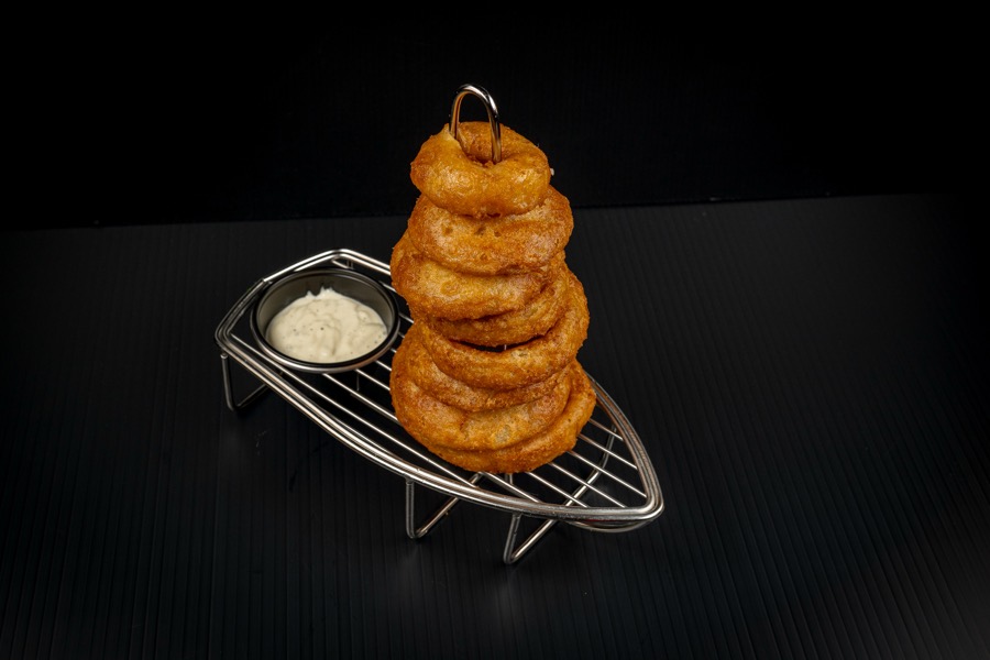Tower of onion rings with dipping sauce