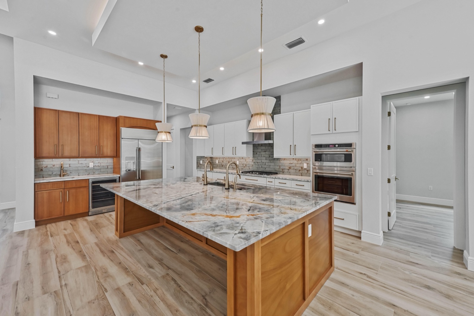 Kitchen with wood island and pendant lights