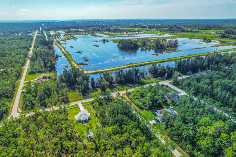 Aerial view of the home near a lake