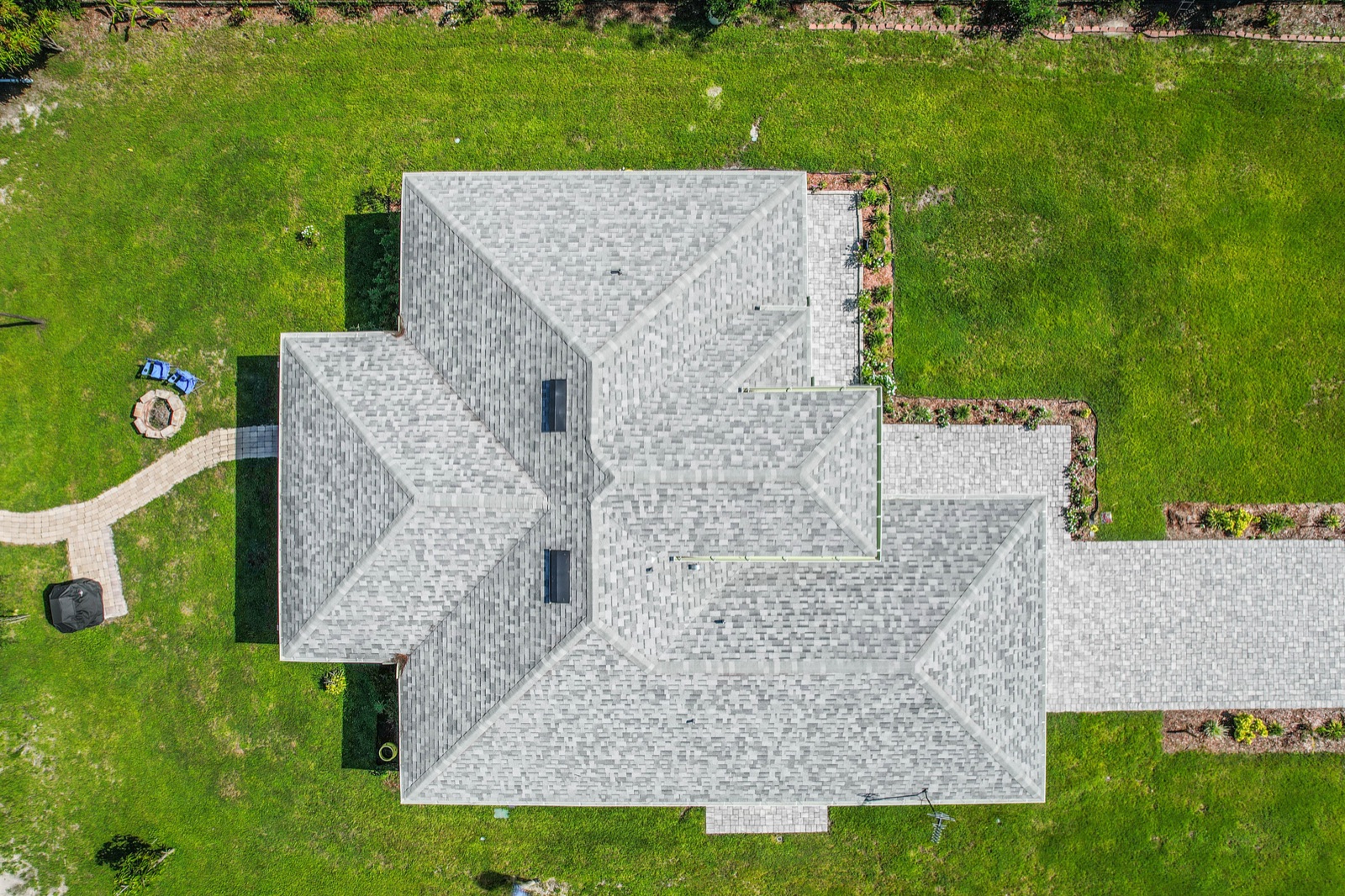 Top-down drone view of a roof and lot